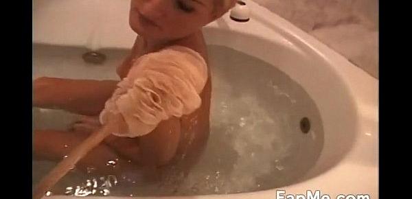  Horny girl rubs a cock in the bathtub